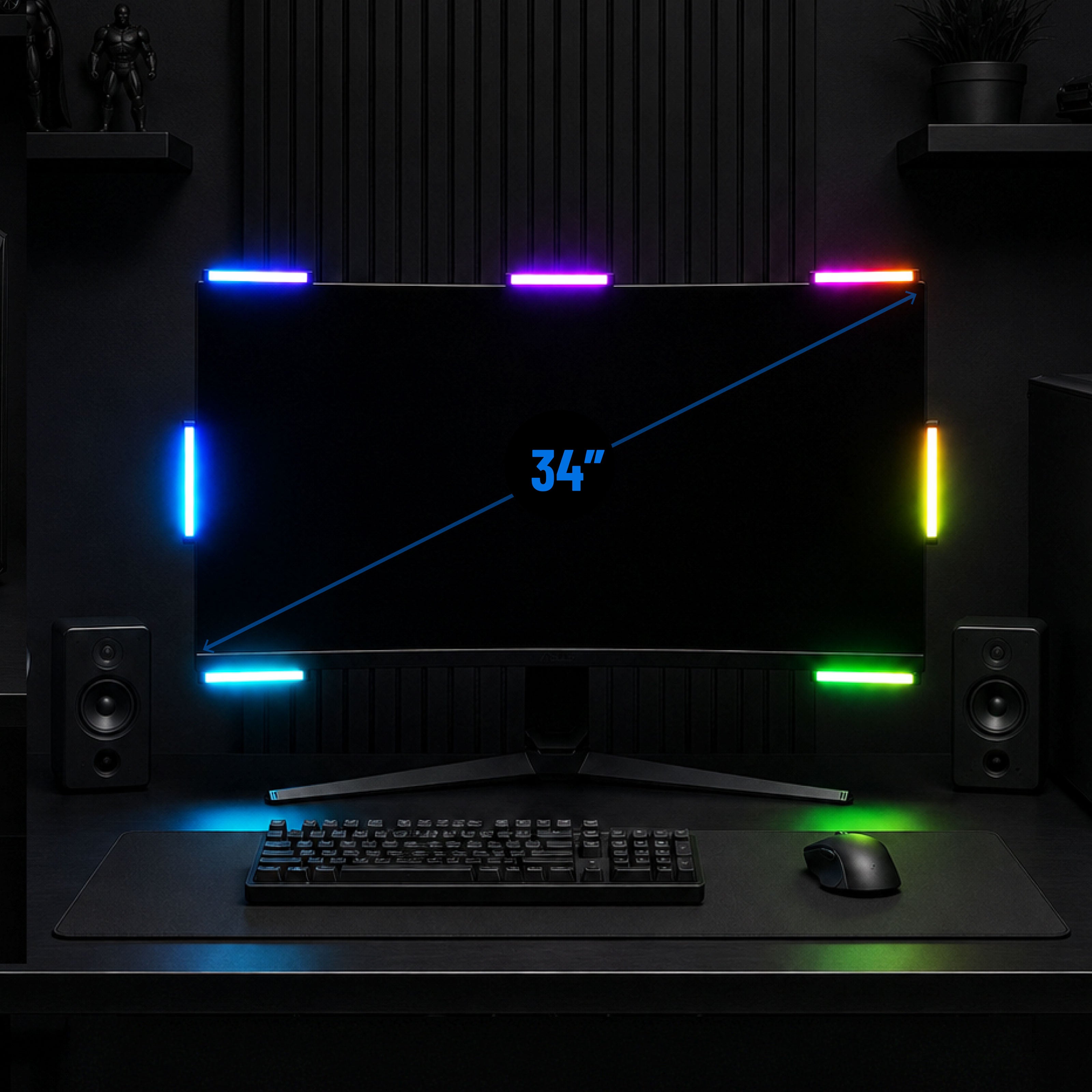 A curved 34-inch monitor on a desk with RGB lighting strips around the bezel and on the desk surface, shown in a dark gaming setup with keyboard, mouse, speakers, and a large mat. Blue diagonal text on the screen reads 34 inches.